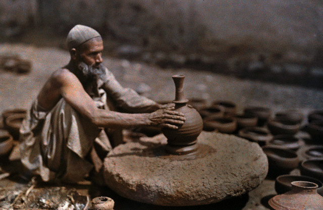 A man works at his potter's wheel Srinagar 1929